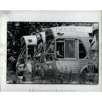 1983 Press Photo Buses waiting repaired Susan Tina - RRW87247
