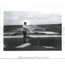 1990 Press Photo Man points out Deteriorating Airport, Texas - hca04842