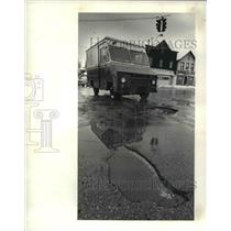 1982 Press Photo Series of pot holes at the corner of East 30th and Payne
