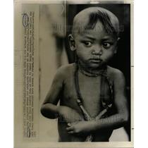 1967 Press Photo Refugee Eyes Young Cambodian neck toy - RRX72423