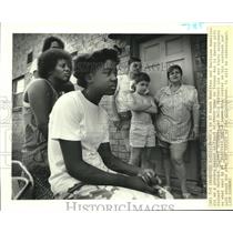 1988 Press Photo "Electric Avenue" neighbors sit in front of their homes.