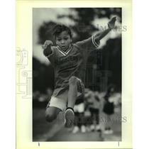 1991 Press Photo Ireka Elmore taking one of her turns in the long jump