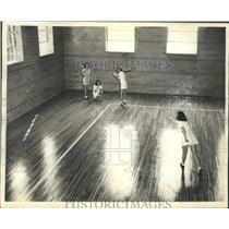 1941 Press Photo Ladies Playing A Softball Game On The Hardwood Floors Of A Gym