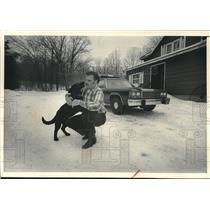 1986 Press Photo Michael Schertz Plays With German Shepherd Pup - mjc25344