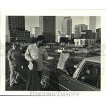 1987 Press Photo U.S. Postal employee receives large bag of tax returns