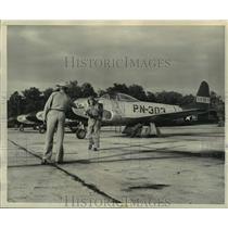 1949 Press Photo Ground Men Check Lt Price Plane After Returning From Flight