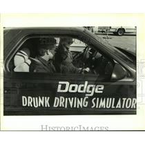 1993 Press Photo Dodge rep. Aaron Corneail in the Dodge Drunk Driving Simulator