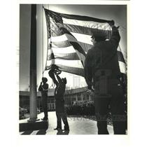 1988 Press Photo Martin Marietta's Michoud facility lower the flag to half-staff
