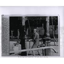 1964 Press Photo Poland Public Pump Woman Resident - RRW03149