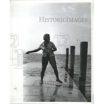 1964 Press Photo Fisherman catch fish swinging pier way - RRX88533