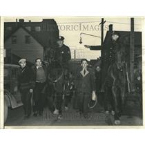 1941 Press Photo Mounted policemen escort man from work