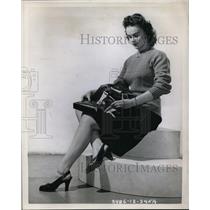 1945 Press Photo Jane Harris folded a Pliocel fuel Cell Gasoline Tanks.