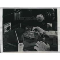 1948 Press Photo Technician Polish the inside curves of the New contact lens.