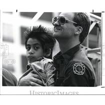 1988 Press Photo Firefighter Mike Majercak and foster chiled Damian Claudio