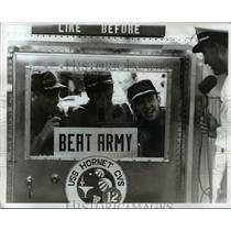 1969 Press Photo Apollo 12 Astronauts, displays a "beat Army" sign in MOF window