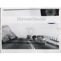 1957 Press Photo Car Passing on Curve No Passing Zone