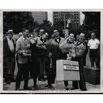 1961 Press Photo Hotel Bellboys celebrate victory in Bulove Bellhop Relay.