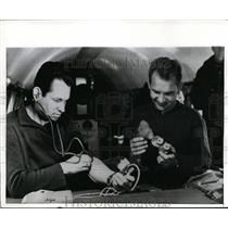 1969 Press Photo Cosmonauts practice self-administered medical checks.