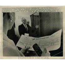 1966 Press Photo Philadelphia-Voter looks over campaign circular before voting.