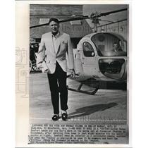1964 Wire Photo Actor Peter Lawford goes to his movie set riding a helicopter