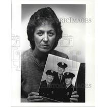 1987 Press Photo Rita Holbert holds the Photos of her husband and Brothers