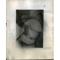 1947 Press Photo Earring & arm bracelets displayed on a fashion model