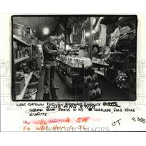 1987 Press Photo Herman Adam stands in his hardware store in LaFitte, Louisiana.