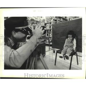 1994 Press Photo Jennifer Rhoto of Kenner has her picture taken by Kenner Police