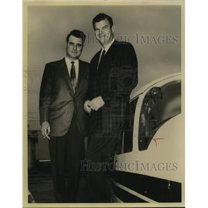 1969 Press Photo E. J. Burke, Jr. with man standing next to plane - saa10349