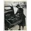 1940 Press Photo War Minister Leslie Hore-Belisha Chauffeur Examines Leaves