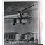 1961 Wire Photo Soviet Navy Helicopter sunggles a house to its fuselage
