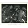 1991 Press Photo New Orleans firemen use air mask to help save woman at fire