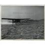 1950 Press Photo The Huskies jet lands on snow covered Battle Harbor, Labrador