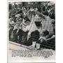 1956 Press Photo Youngster going after a ball when a foul tip stuck in screen.
