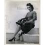 1945 Press Photo Jane Harris folded a Pliocel fuel Cell Gasoline Tanks.