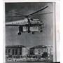 1961 Wire Photo Soviet Navy Helicopter sunggles a house to its fuselage