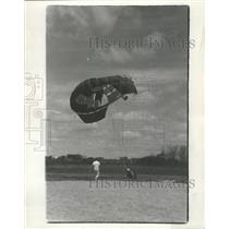 1966 Press Photo Ground Person Runs To Help Sky Diver Who Just Landed On Ground