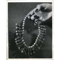 1941 Press Photo Artificial parls & pencil erasers necklace