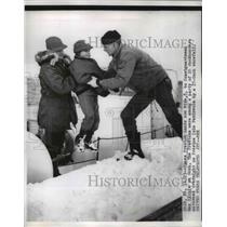 1956 Press Photo James Preston hands his son Mike to a coast guardsman on a dock