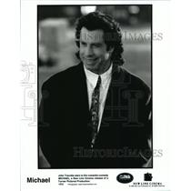Press Photo John Travolta in MICHAEL, a romantic-comedy film - cvb75709