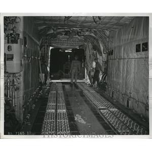 1857 Press Photo The unloading scene of crane cab from Lockheed C-130 plane