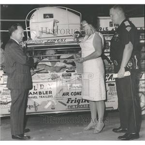 1963 Press Photo Publicity Stunts:  A driver sealed aut