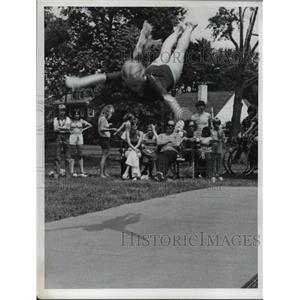 1974 Press Photo Girl takes a leap in the air during gymnastics routine