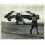 1957 Press Photo control man wigwags a Douglas A-30 Skywarrior bomber on deck