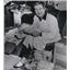 1955 Press Photo Liberace reading tons of mail from Ethiopia