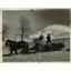 1937 Press Photo E.L Simpson, Farmer seeding hay for his sheep in Ohio