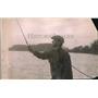 1919 Press Photo A man out fishing from a lake side