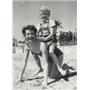 1954 Press Photo Swedish boy actor Kjel Sucksdorff playing on the sandy beach