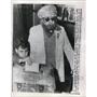 1961 Press Photo Moslem Youngster drops his blind grandfathers vote in ballot