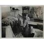 1936 Press Photo of a colonist drying wool in a native kettle - nee42605